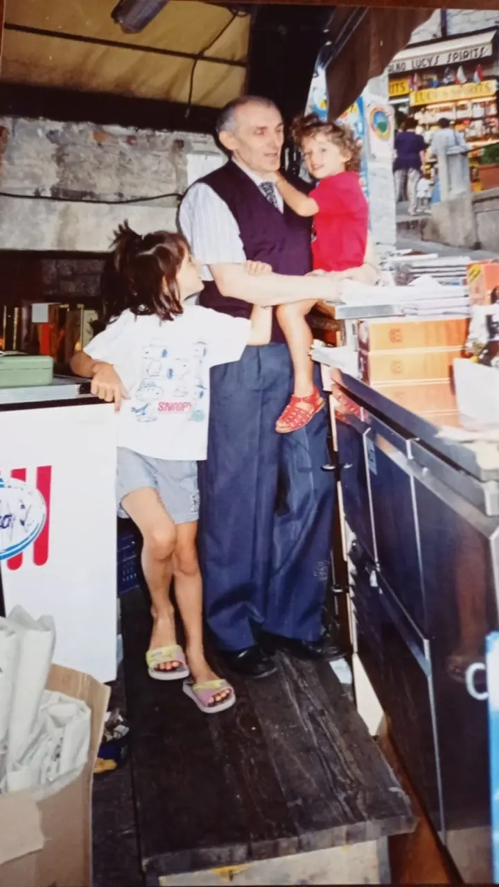 Giacomo with the children in the family restaurant